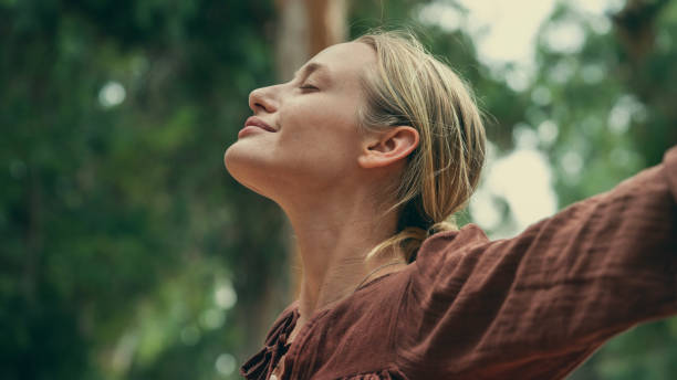 Woman breathing freely outdoors after mold toxicity treatment in Chicago at Bliss MD