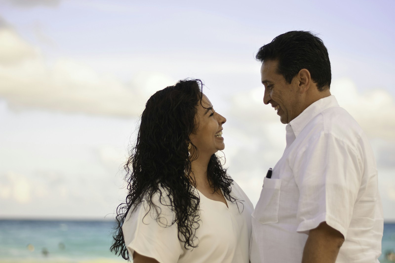 Functional medicine clinic Naperville patients: healthy couple smiling by the water