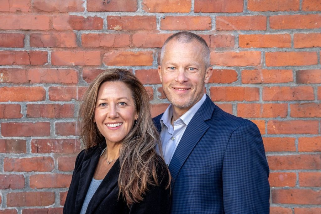 Functional medicine in Barrington: healthy couple in their 40s smiling together outdoors