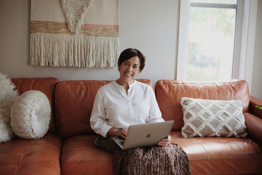 HRT cost Chicago: woman reviewing notes on a laptop in a bright home
