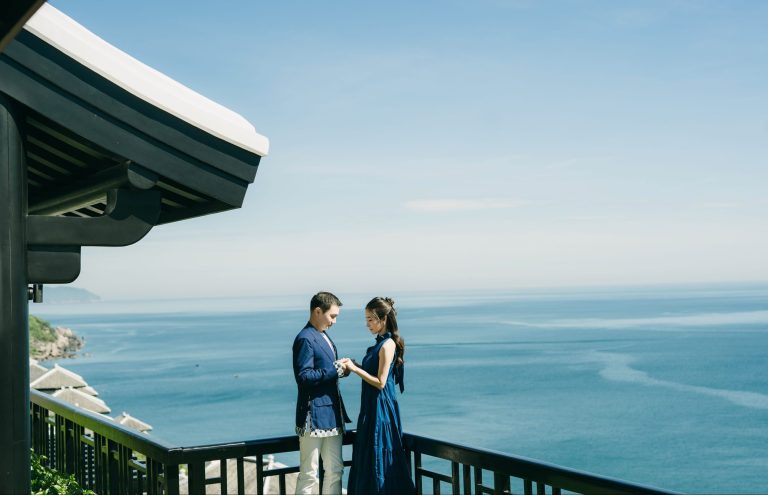 P Shot benefits: couple on a seaside balcony overlooking blue water