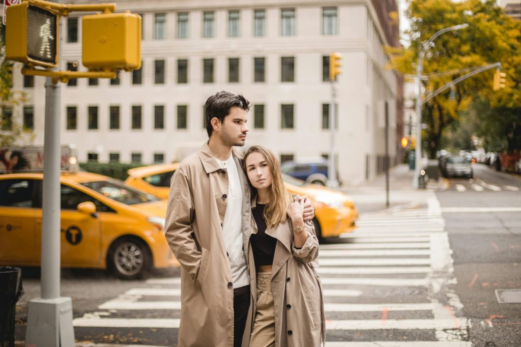 P-Shot vs shockwave: couple in trench coats at a New York crosswalk