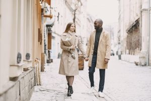 PT-141 for men: stylish couple walking together in camel coats