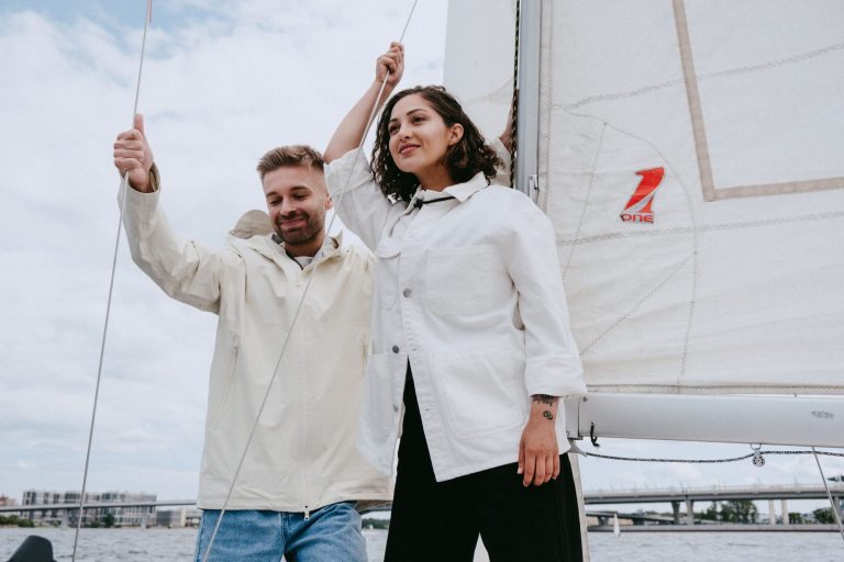 PT-141 and ED medications: couple smiling together on a sailboat