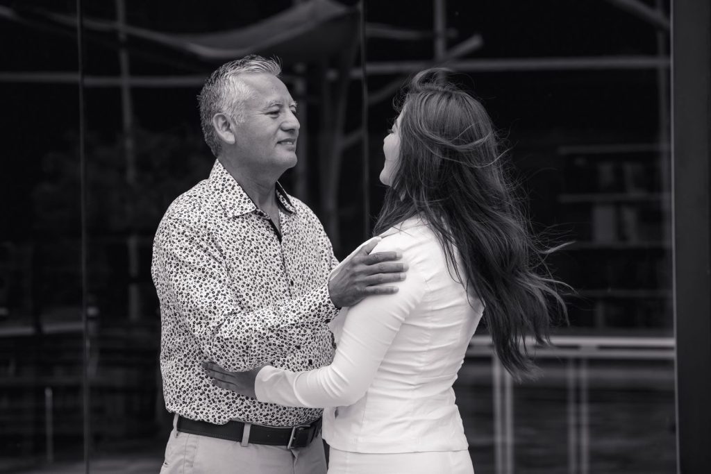 Trimix or quad mix injections: grey-haired man dancing with his partner in a black-and-white photo